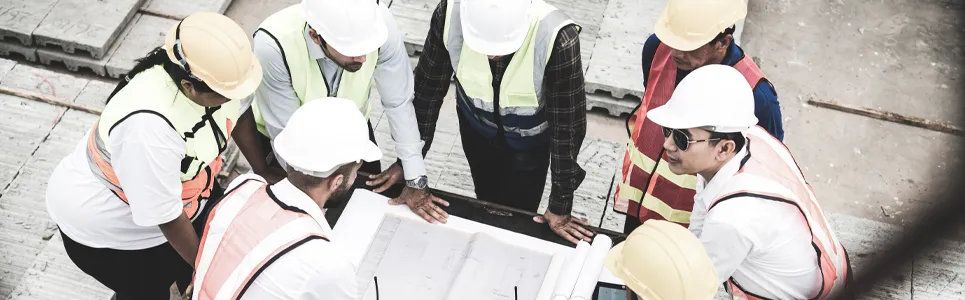 field-workers-going-over-a-construction-project-plan